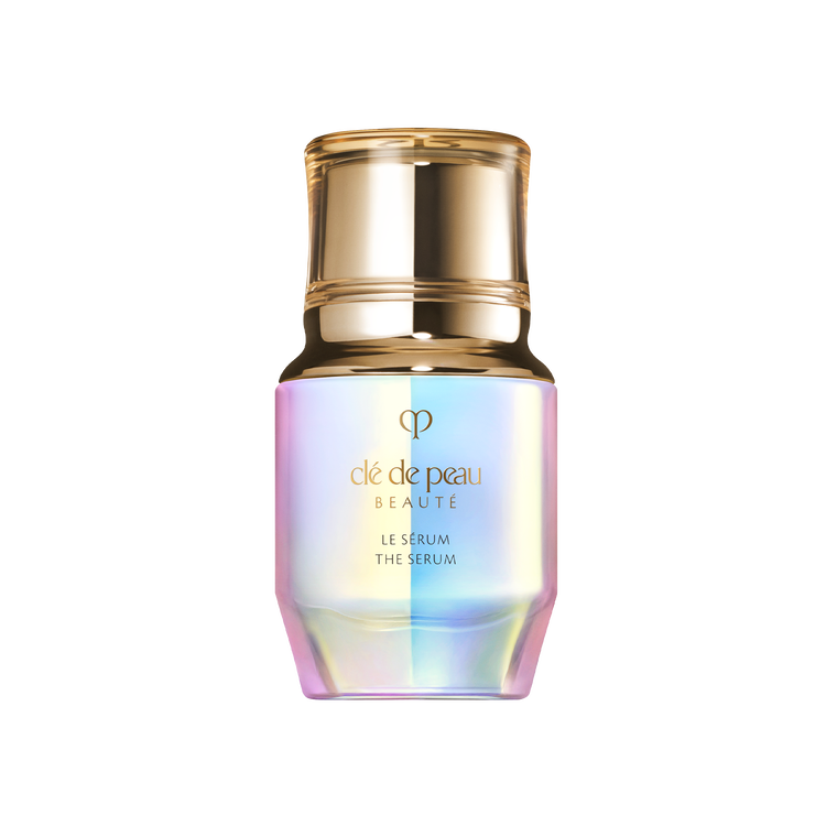 Clé de Peau Beauté "Le Sérum" in a prismatic glass bottle with a gold pump top.