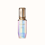 Clé de Peau Beauté "Le Sérum" in a prismatic glass bottle with a gold pump top.