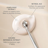 Creamy white skincare texture with a silver spoon, highlighting Lempuyang Extract for firmness, Retinol ACE for fine lines, and Golden Botanical Extract for anti-aging.