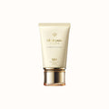 A tube of Clé de Peau Beauté UV Protective Cream with SPF 50+, in an elegant cream-colored tube with a gold cap.