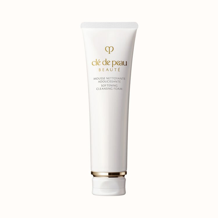 A white tube of Clé de Peau Beauté Softening Cleansing Foam with a gold band at the bottom.